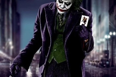 Download Joker Showing His Card Wallpapers For HTC Desire