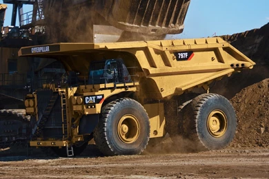 Cat 797F left front shovel loading close crop 1.jpg