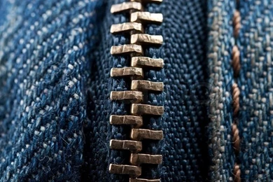 Closeup Of Zipper On Jeans Clothing Backgrounds
