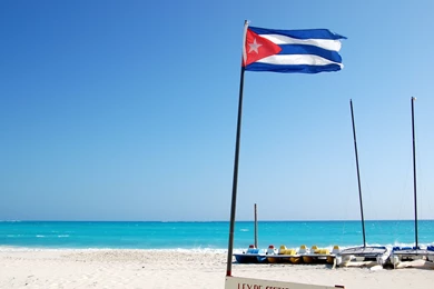 Flag Of Cuba On The Beach In The Resort Of Cayo Largo, Cuba ...