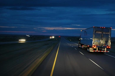 Prime inc on the road at night