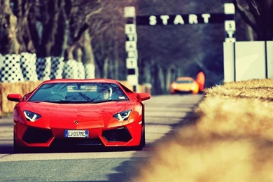 1366x768 Orange Lamborghini Aventador On The Track Desktop PC And ...