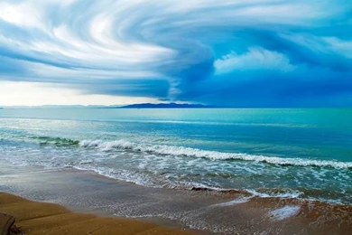Swirling Clouds Above The Ocean Beach Wallpapers 2560x1600 ...