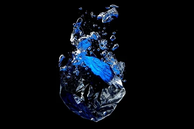 Ice Cube Falling Into Water Against A Black Backgrounds With ...