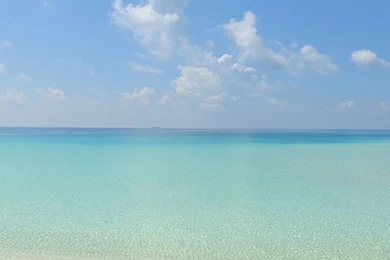 Download Wallpapers 750x1334 Beach, Sand, Chairs, Resort, Sky ...