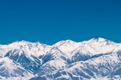 Wallpapers 2560x1440 Rocky Mountains Covered With Snow Under Clear ...