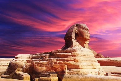 Wallpaper of Egyptian sphinx and pyramid on sunset.jpg