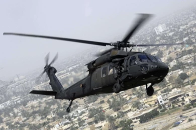 Download 1366x768 Sikorsky UH 60 Black Hawk Flying Over A City ...