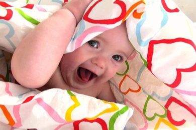 Naughty Baby In Bed Sheet Wallpapers