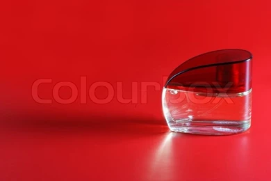 Perfume. A Bottle Perfume On A Red Backgrounds With Effective ...