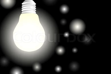 Light Bulb With Glowworms Over Black Backgrounds Stock Photo