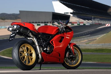 Awesome red Triumph Bike HD Wallpaper.jpg