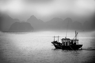 Silhouettes Of Halong Bay Fishermen
