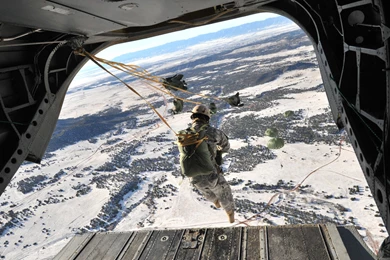 File:Flickr   DVIDSHUB   Paratroopers Jump Toward Snow covered ...