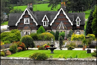 Houses Surrounded Flowers Peaked Roof Patio Furniture Trees Rock ...