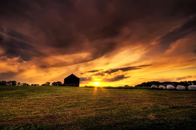 Old Farm House In The Field At Sunset