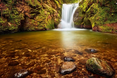 Beautiful Waterfall Between The Mossy Cliffs Wallpapers