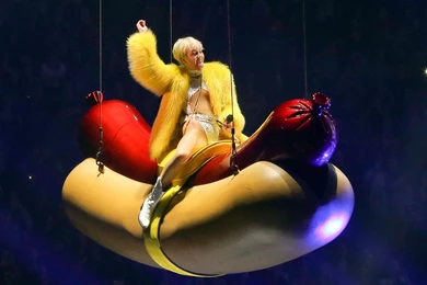 Miley Cyrus Riding A Giant Hot Dog   Wallpapers Bros.