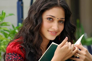 Tamanna Bhatia reading a book sexy smile best wallpapers.jpg
