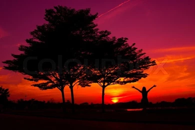 A Woman Relaxing On A Teeter With Sunset In A Backgrounds