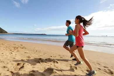 People running on beach jogging widescreen high definition ...