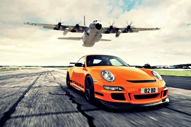 Awesome Orange Porsche 911 Races Againt Lockheed AC 130 Cargo ...