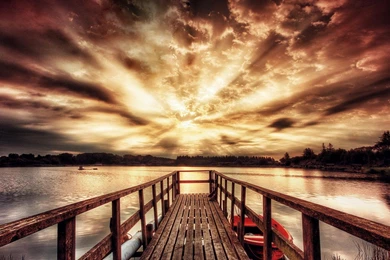Boat Dock On A Lake Under Majestic Sunset   (