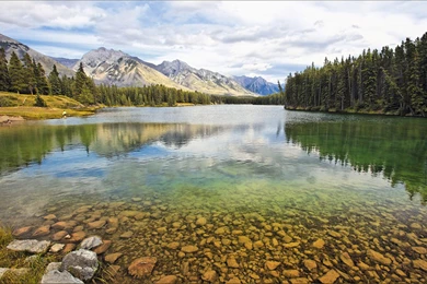 Blue Sky And Clear Water Between The Mountains And Trees ...