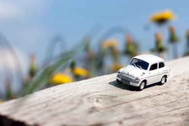 Miniature Toy Car On Wood Wallpapers