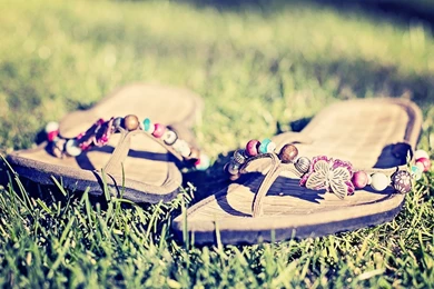 A Pair Of Flip Flops In The Grass