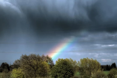 Rainbow Through Rain Clouds   (