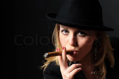 Beautiful Girl In A Hat With A Cigar On A Black Backgrounds