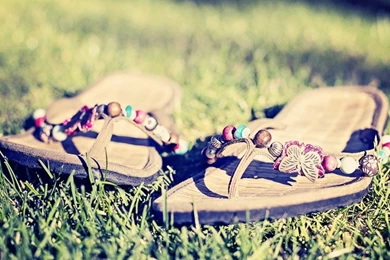 A Pair Of Flip Flops In The Grass