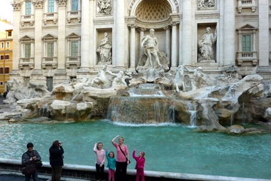 Throwing A Coin In The Trevi Fountain