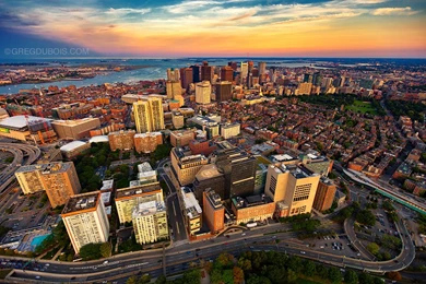Aerial View Of Boston Skyline At Sunset From Helicopter With West ...