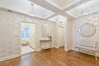 Metallic Floral Wallpaper, A Beveled Mirror, And Crystal ...