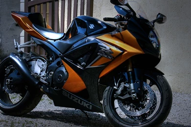 Suzuki Motorcycle Parked Outside The House Wallpapers