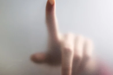 Hand On Frosted Glass