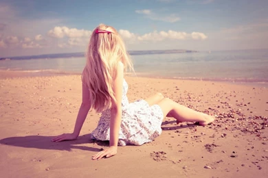 1366x768 Lonely Girl Sitting On Beach Wallpapers