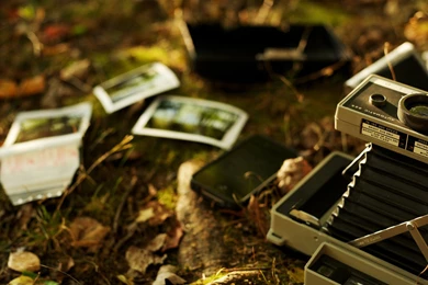 Old Polaroid Camera And A Phone