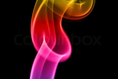 Multi coloured Smoke On A Black Background.