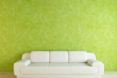 White Sofa With Green Wallpapers