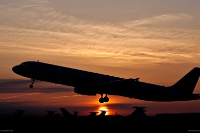 1366x768 Silhouette Of An Ascending Plane Wallpapers