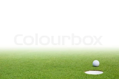 Golf Ball On Green Grass And White Backgrounds