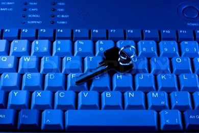 Key Rests Upon Computer Keyboard , Blue Backgrounds