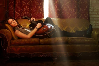 Download Wallpapers 2560x1440 Brandi Carlile, Girl, Guitar, Couch ...