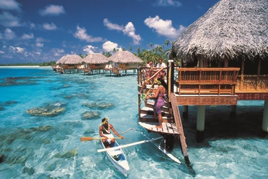 Download 2560x1600 Kayaking Near The Overwater Bungalow Wallpapers