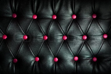 Abstract Black Leather Against Pink Dot Backgrounds
