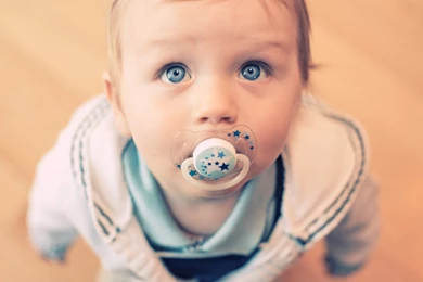 Cute Baby Boy Eating A Toy Best Photo