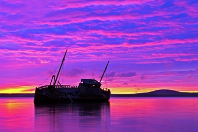 1680x1050 Shipwreck Purple Sunset Wallpapers